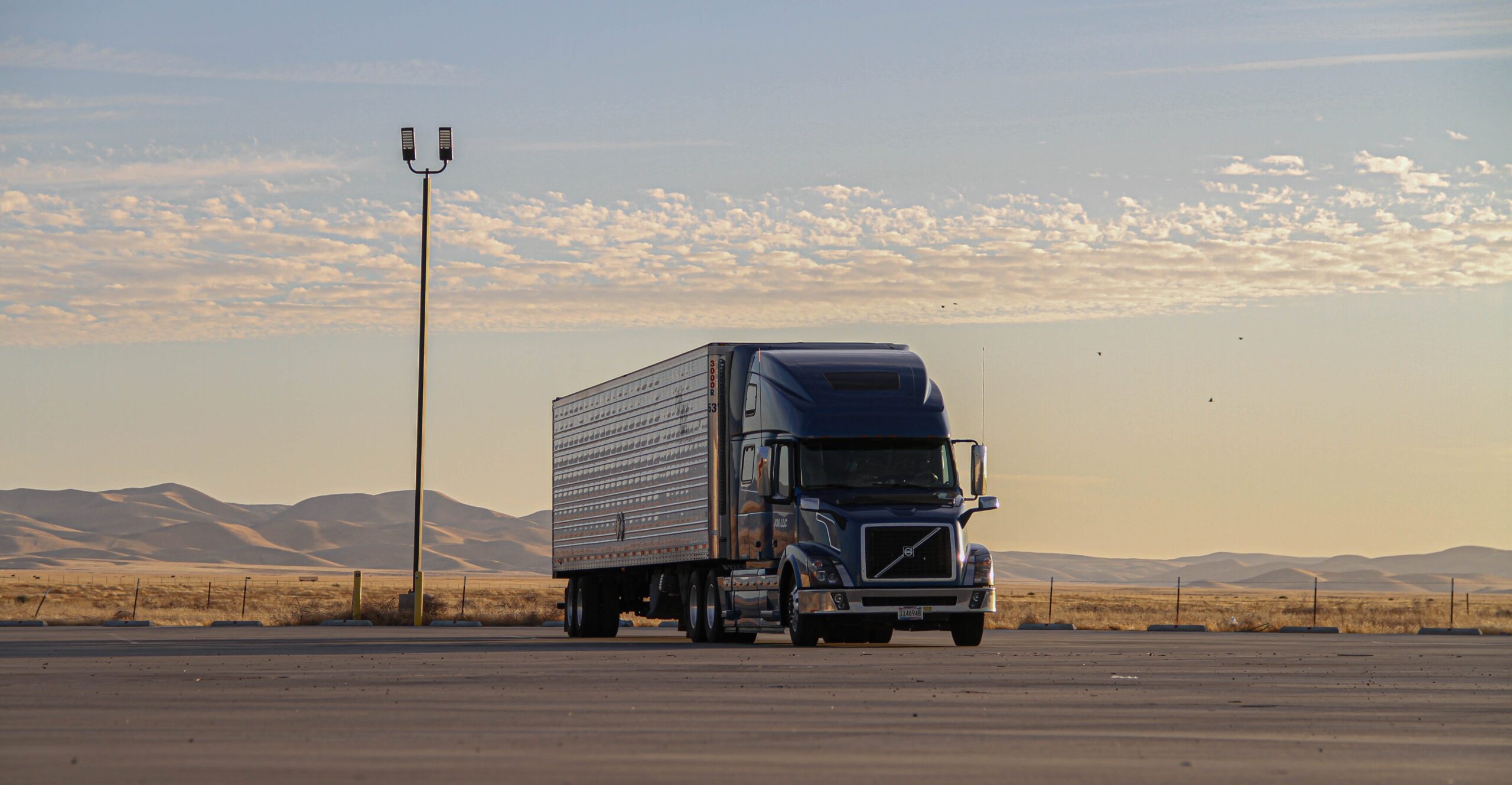 truckload on the road during sunrise